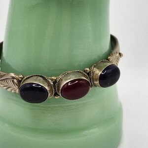 Beautiful cuff bracelet red & purple stones.  Sterling silver? not magnetic.SALE